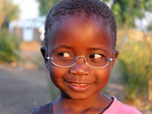 Girl in Malawi with one-dollar glasses