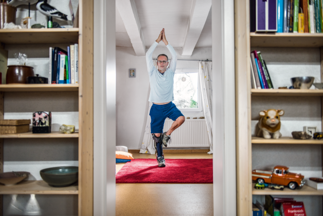 User Wolfgang is affected by paralysis in his right leg as a result of post polio syndrome. Here you can see him doing yoga with C-Brace.