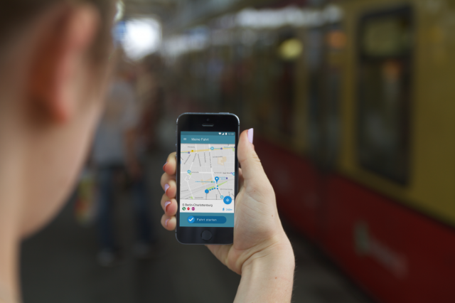 Person looking at the smartphone that is showing the TicketEasy app.